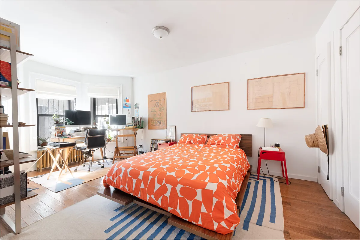 garden level bedroom with room for an office space