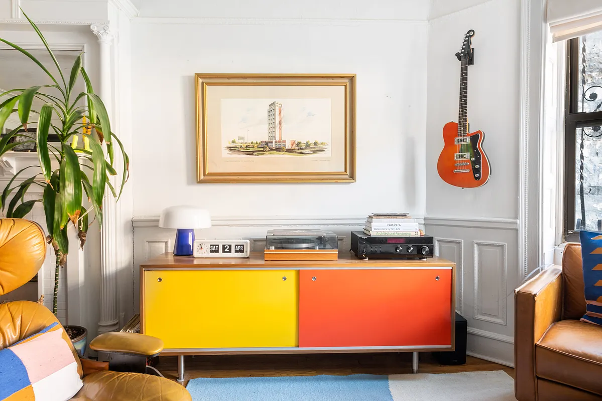 detail in garden level apartment living room showing wainscoting