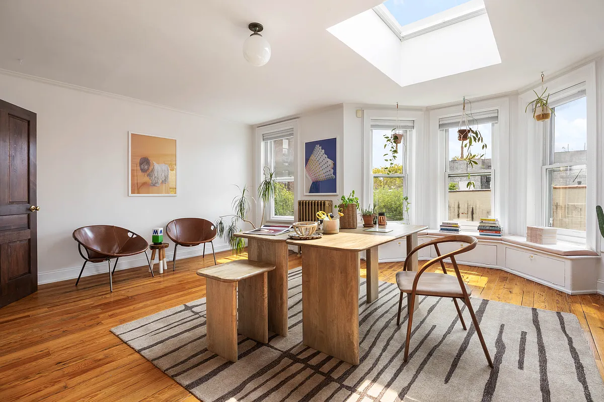 top floor room with skylight set up as an office
