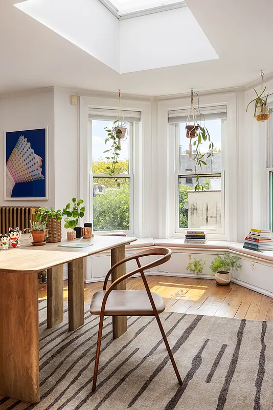 top floor room with skylight set up as an office