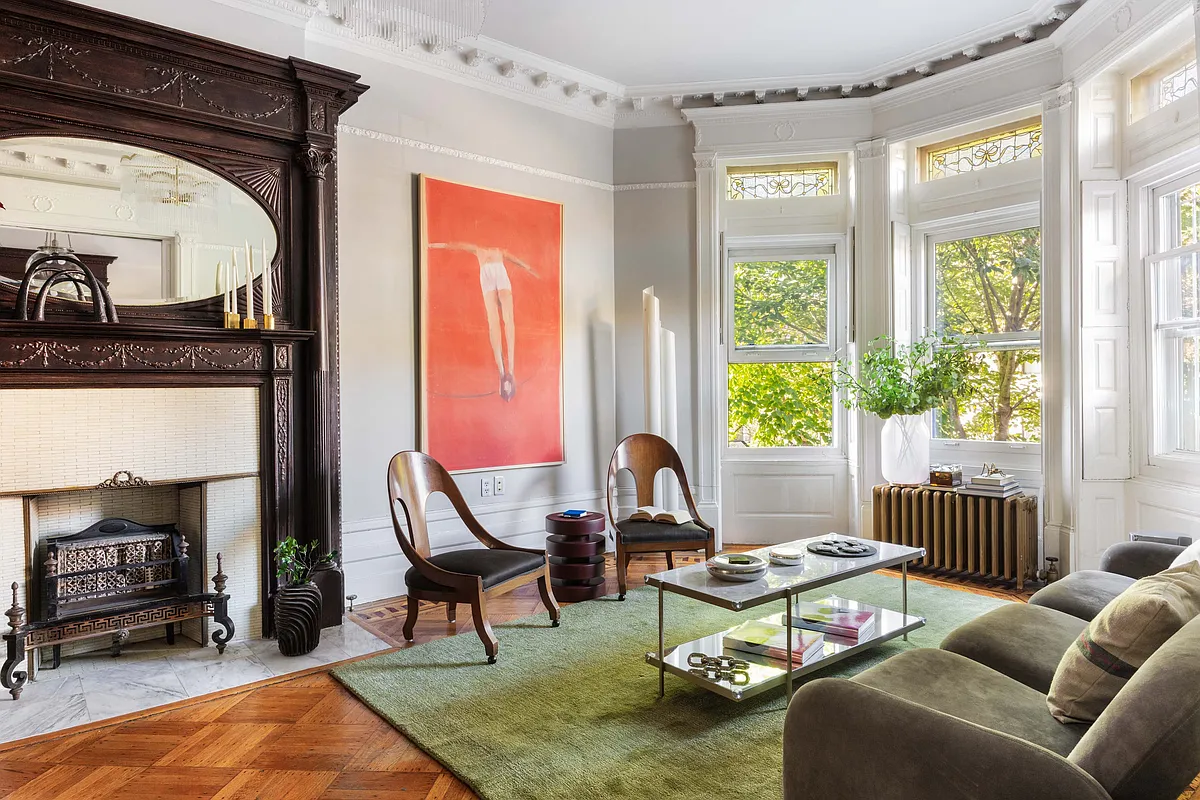parlor with stained glass, mantel with oval mirror