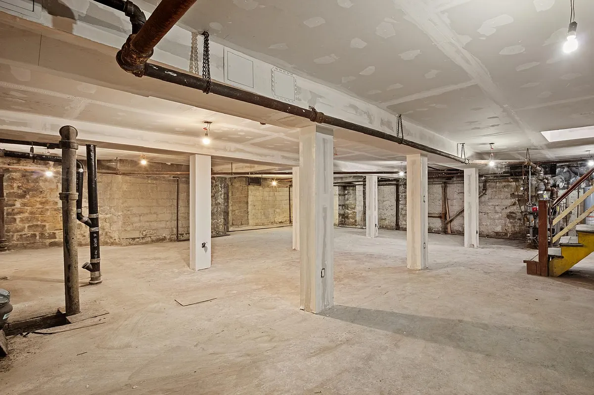 unfinished basement with view of mechanicals
