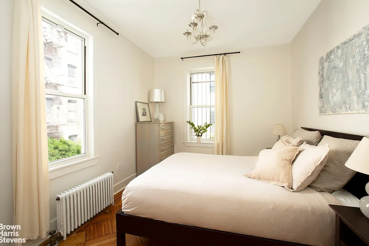 bedroom with two exposures, wood floor