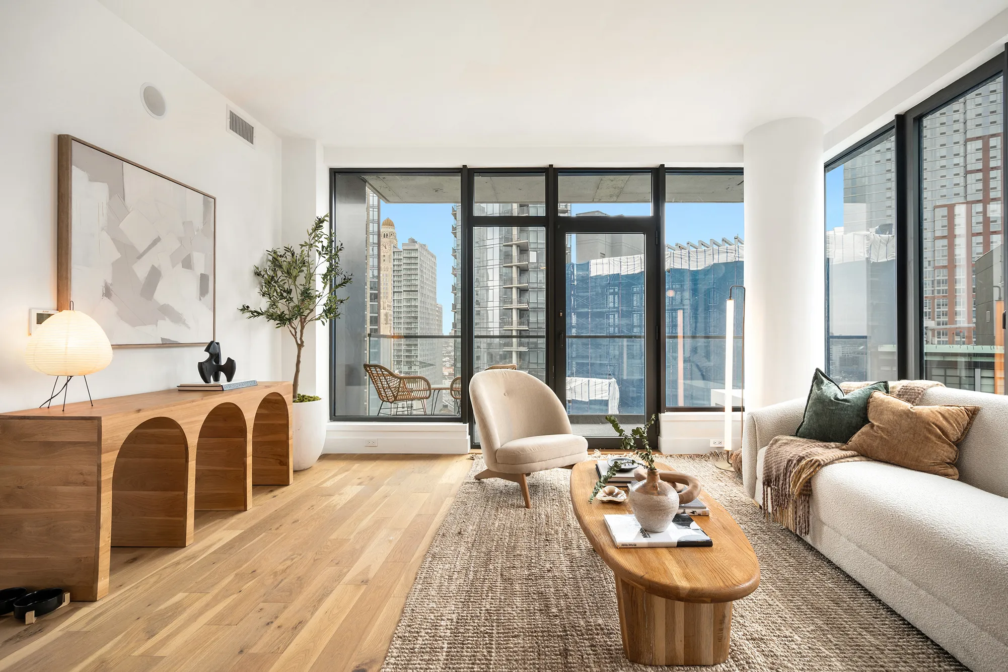 living room with a glass wall and door to a terrace at 20 rockwell place