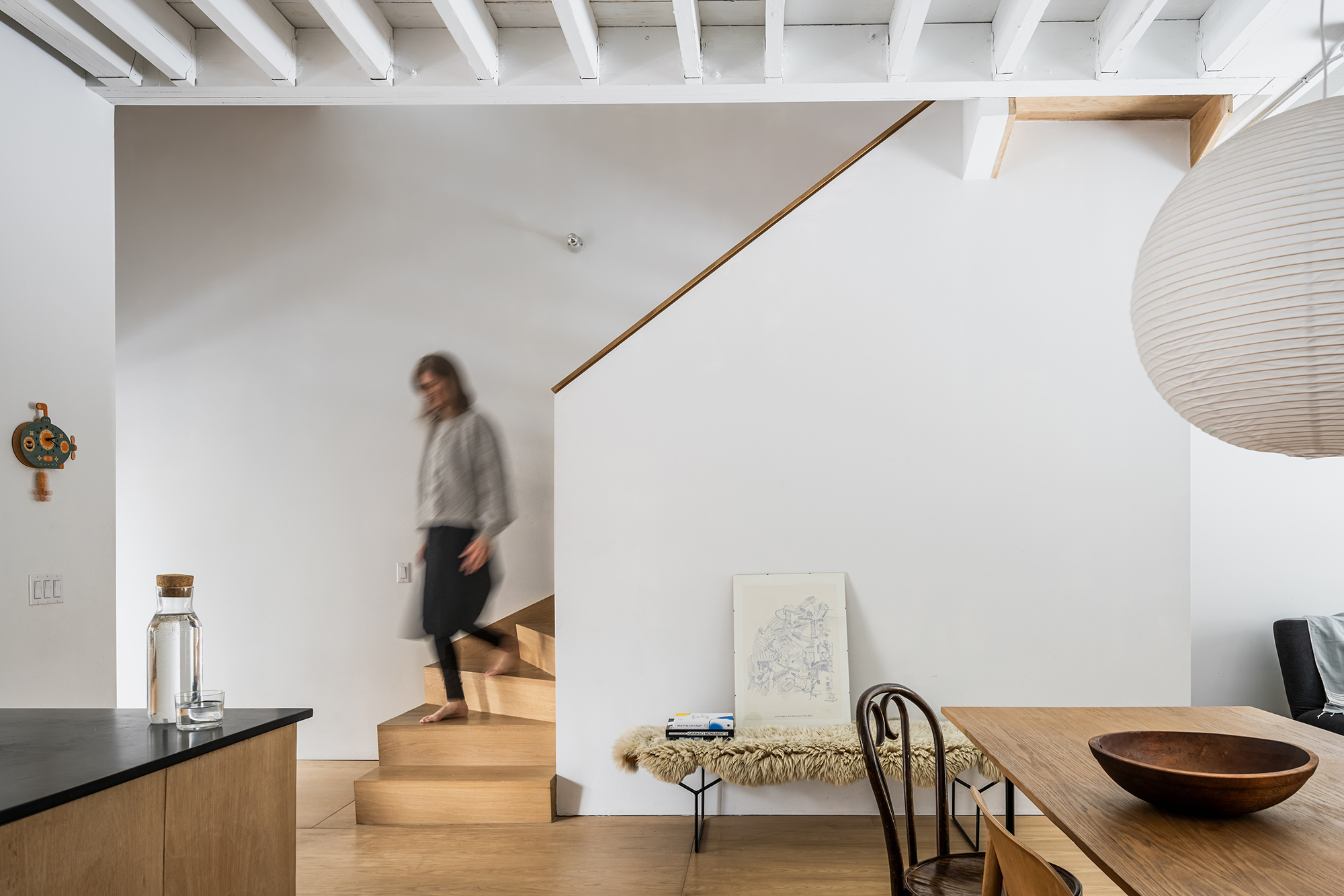SIDE OF STAIRWELL GLIMPSE OF KITCHEN DINING