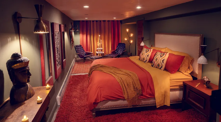 lower bedroom with recessed lighting, green walls