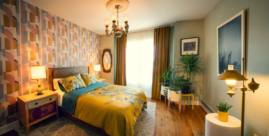 bedroom with one wall of graphic wallpaper