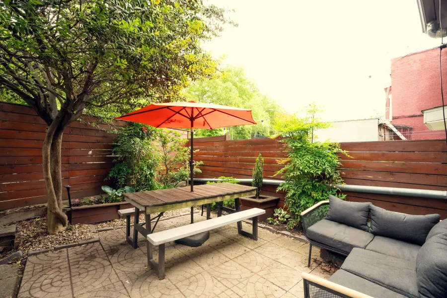 rear yard with paved patio and a seating area