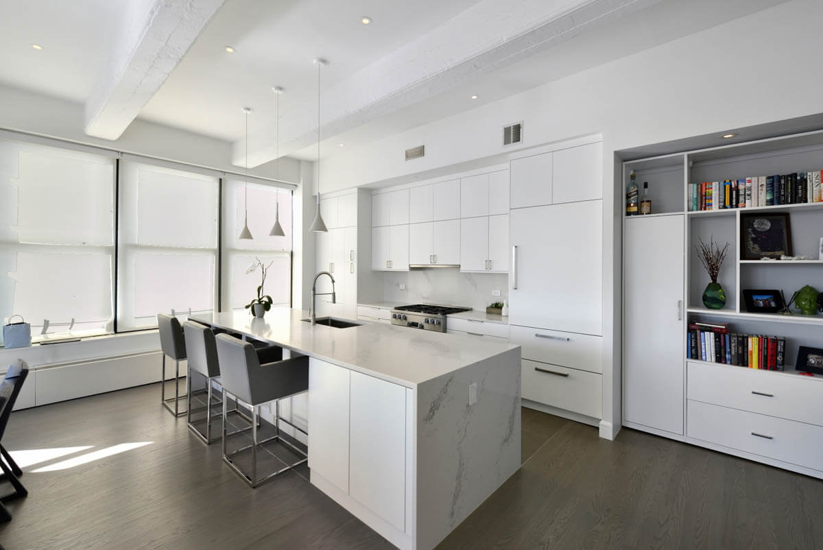 kitchen with all white cabinets and a large island