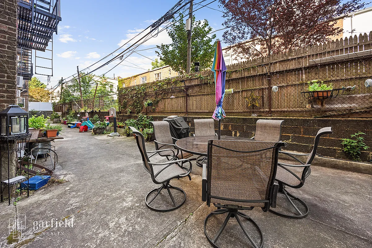 concrete courtyard with tables, play equipment