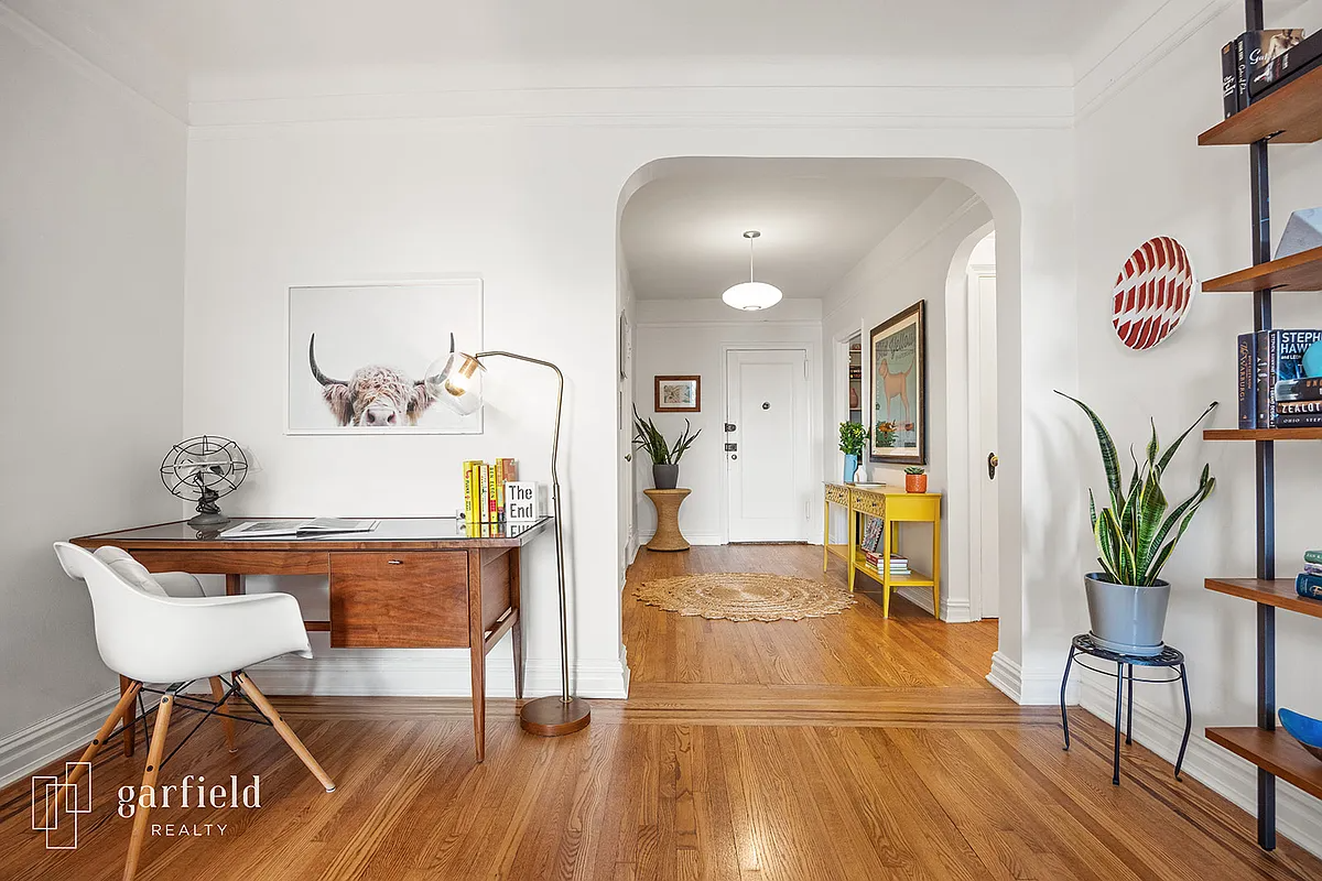arched doorway from living room to foyer