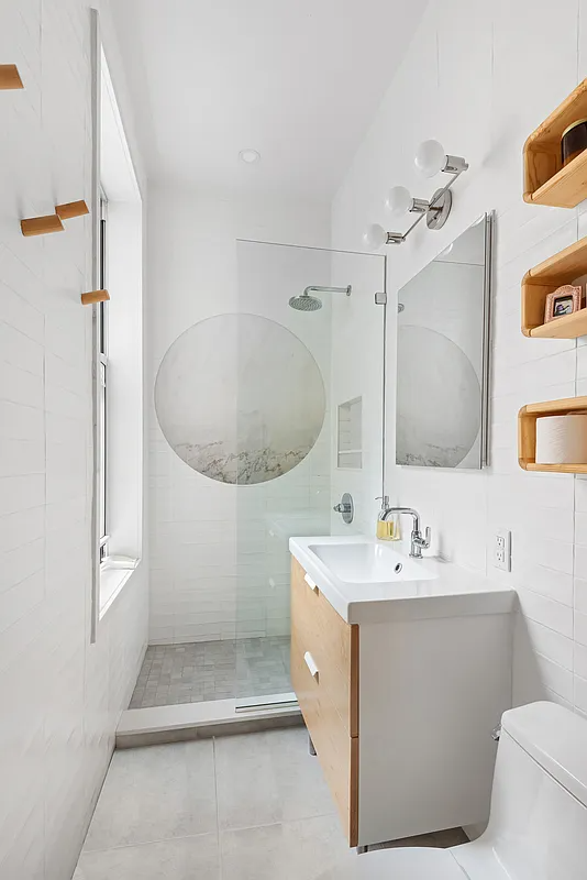 bathroom with a walk-in shower
