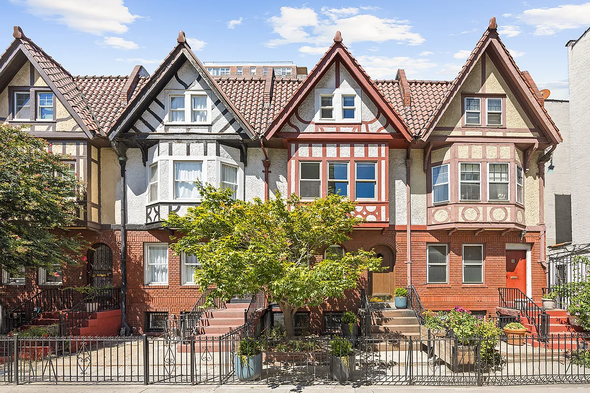 a row of tudor houses with half timbering and bay windows