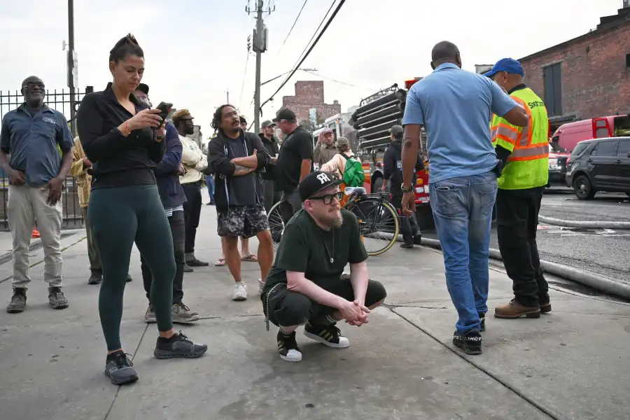 people gathered on a sidewalk