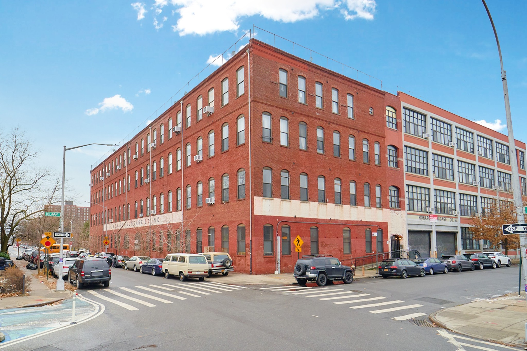 brick building with monarch luggage sign
