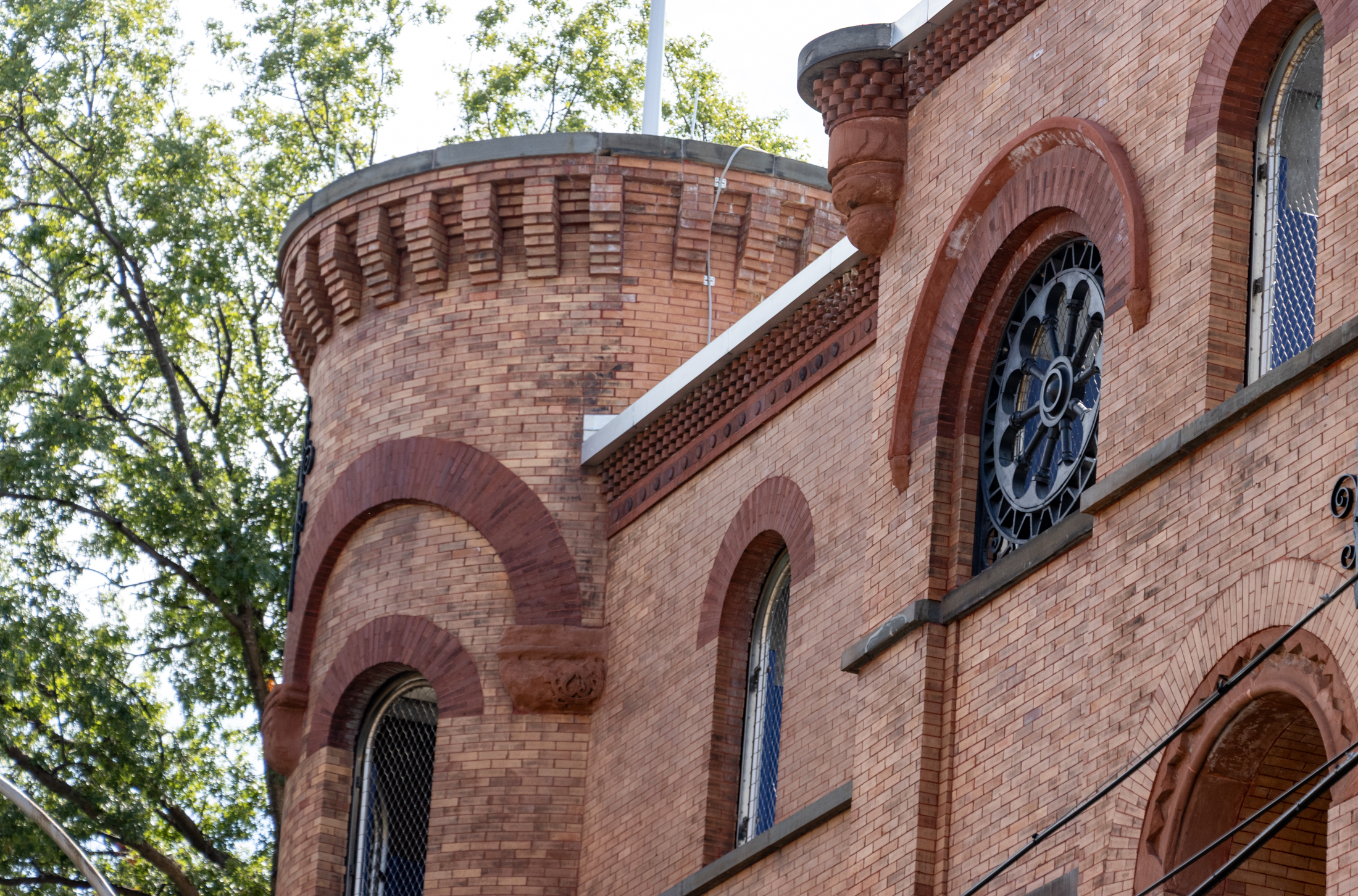 historic brick building with a round tower