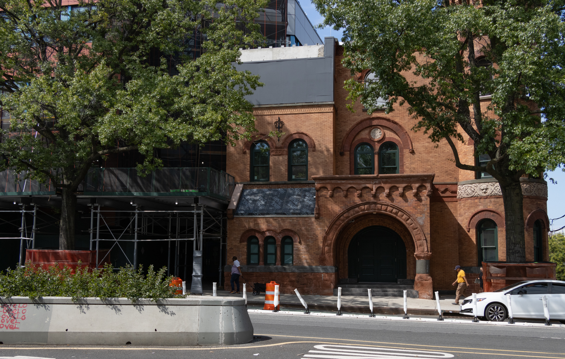 a brick building with brownstone ornament