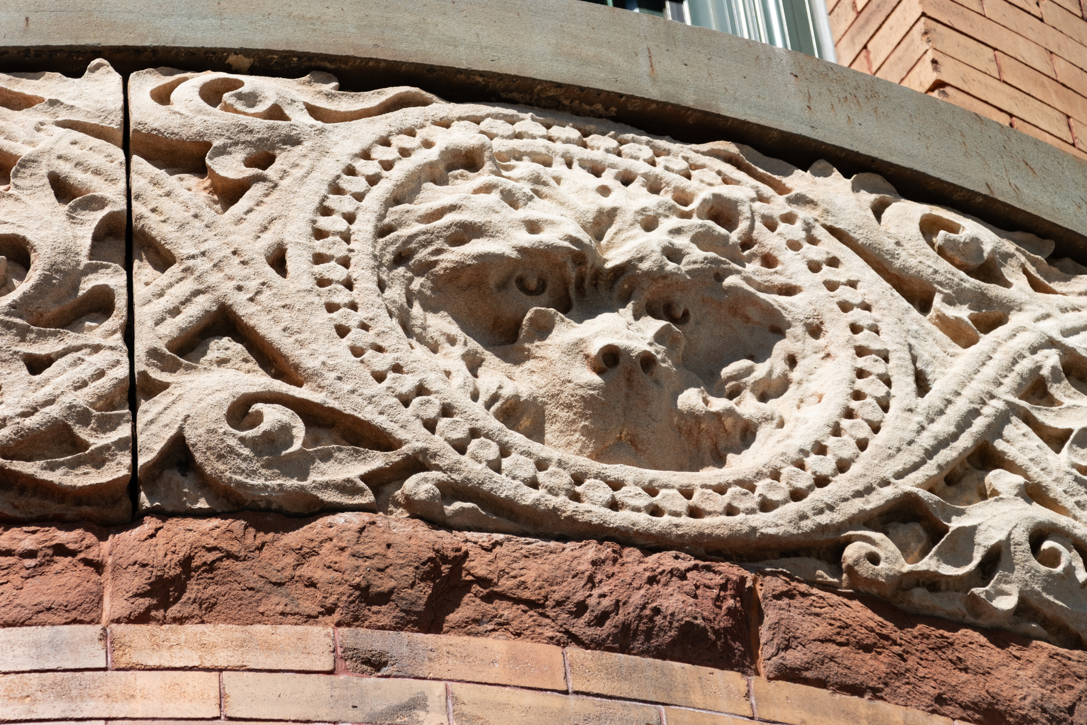 decorative detail of a bear face on the historic building