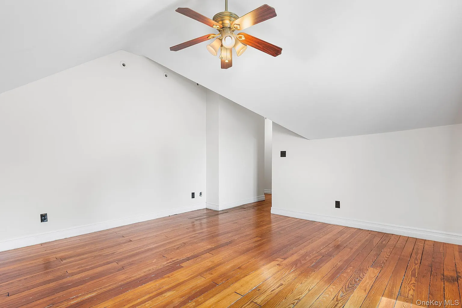 bedroom with white walls, ceiling fan