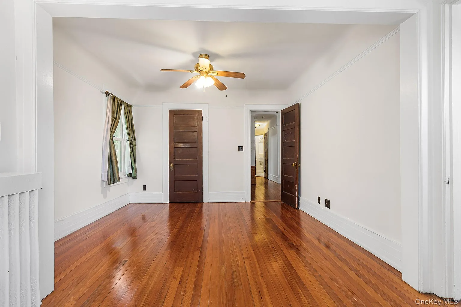 bedroom with a ceiling fan and a closet