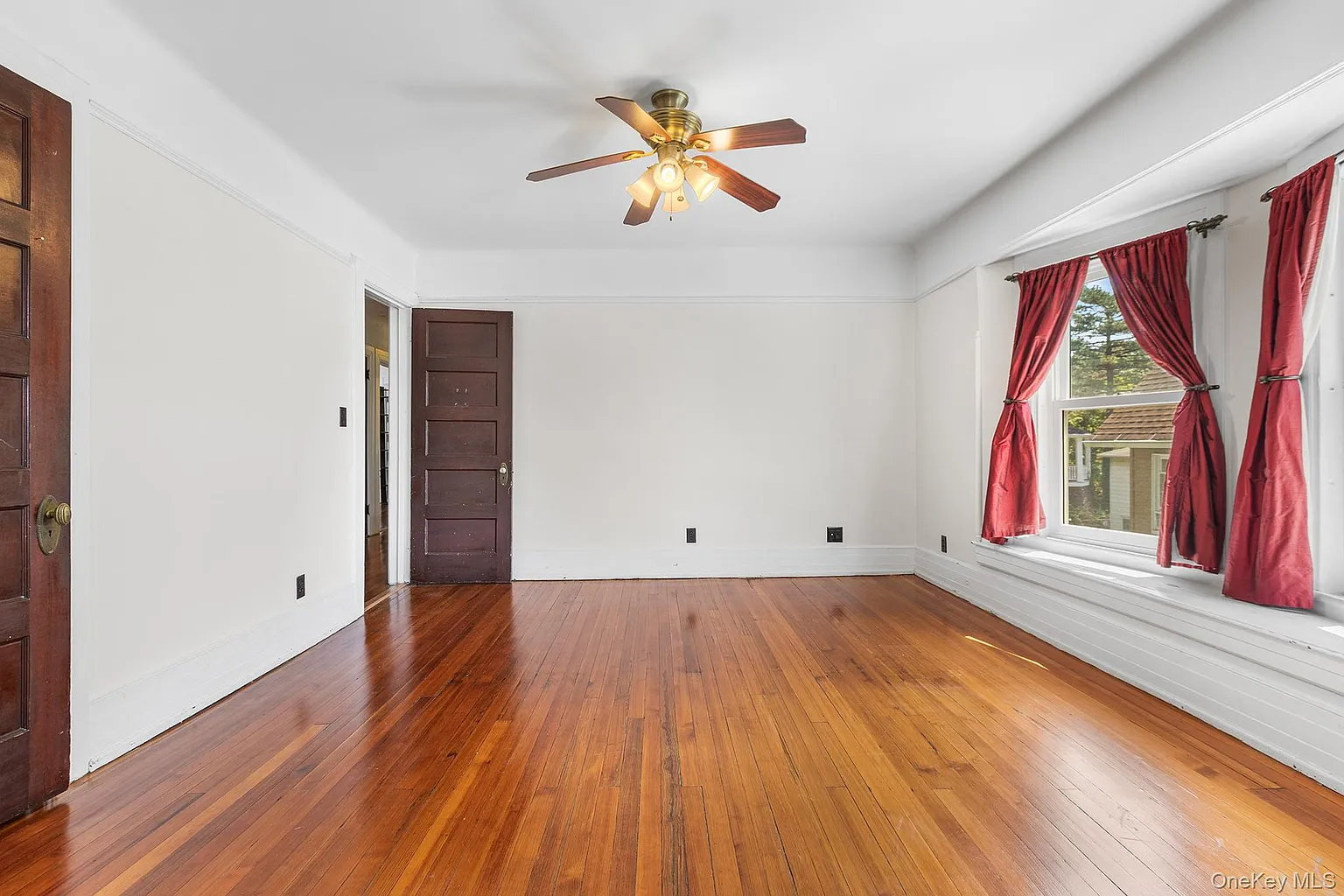 bedroom with window seat and a ceiling fan