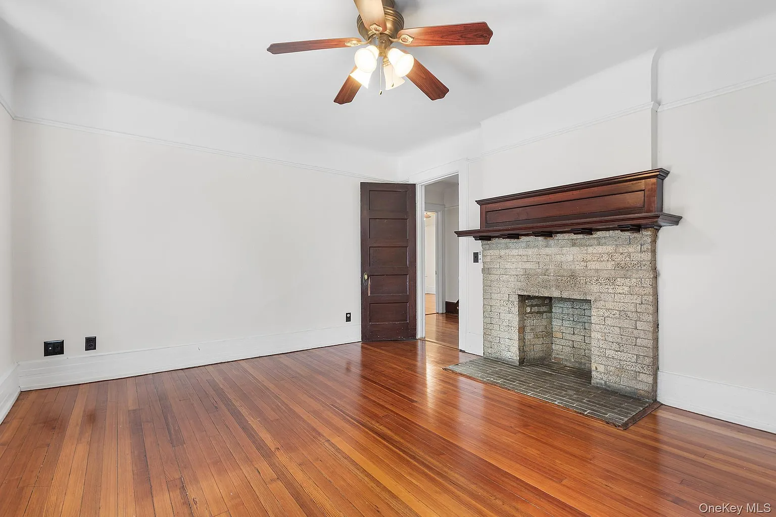 bedroom with a brick fireplace