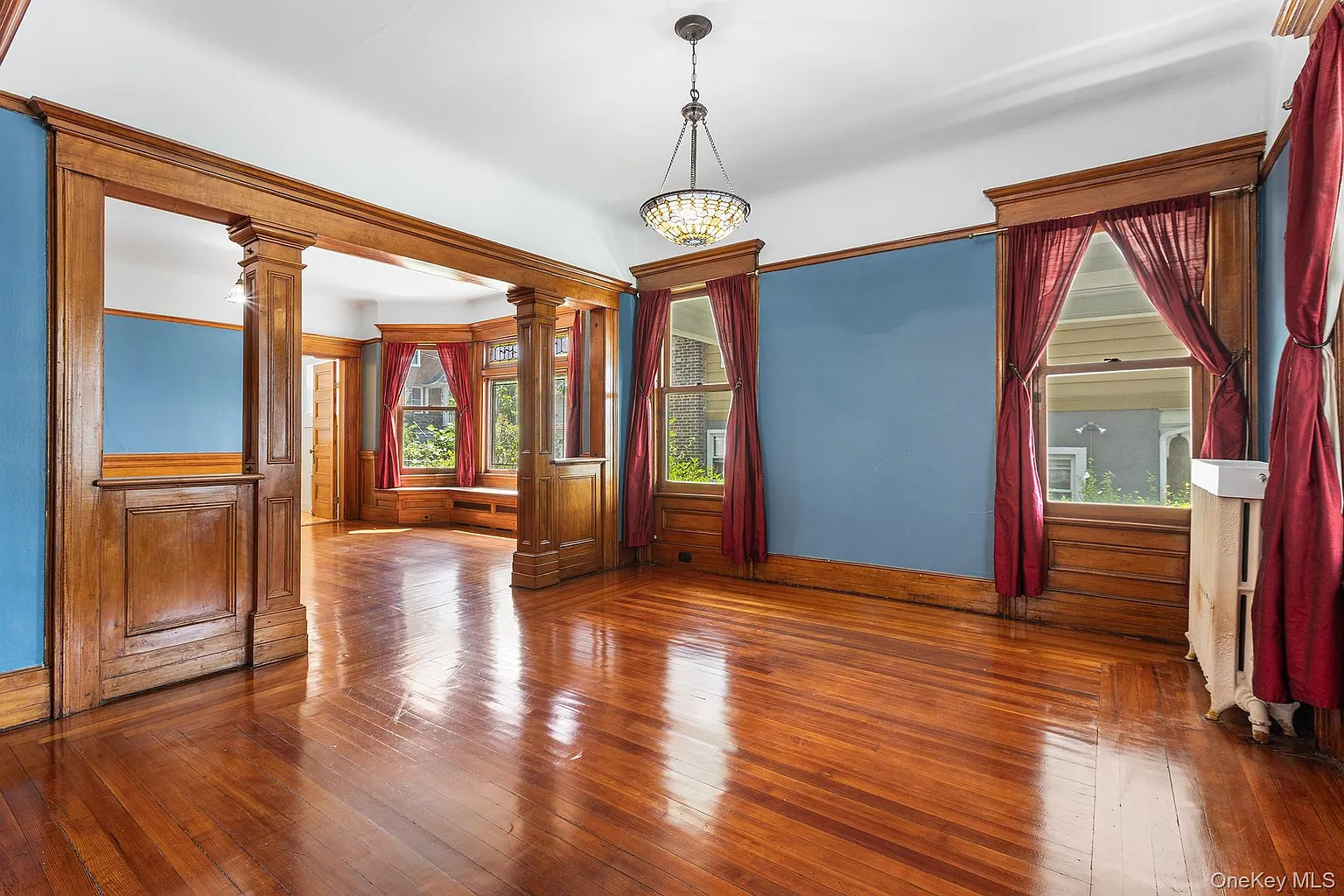 columned screen dividing dining room and parlor