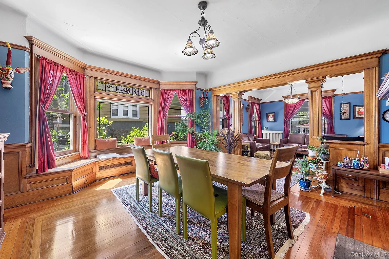 room with window seat set up as a dining room