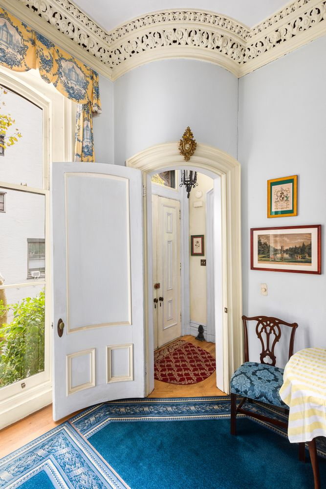living room with plasterwork, view into entry