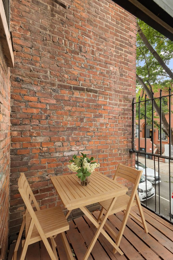 terrace staged with a table and chairs