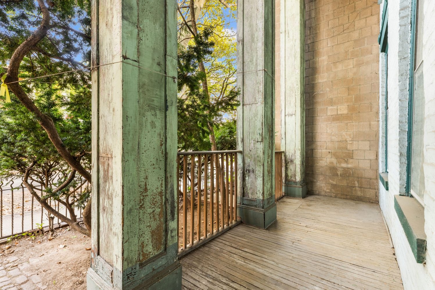 front porch with green painted columns