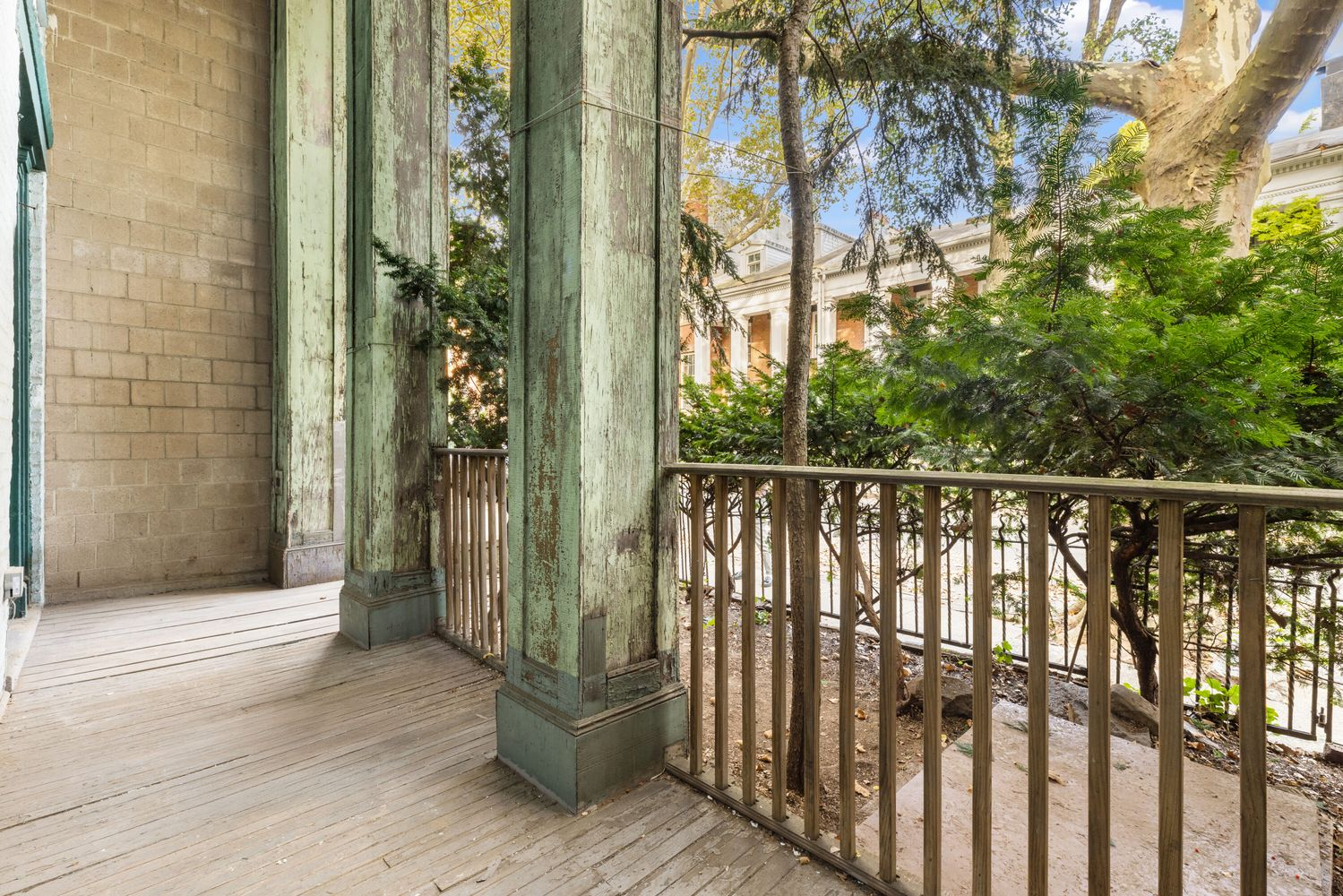 front porch with green painted columns