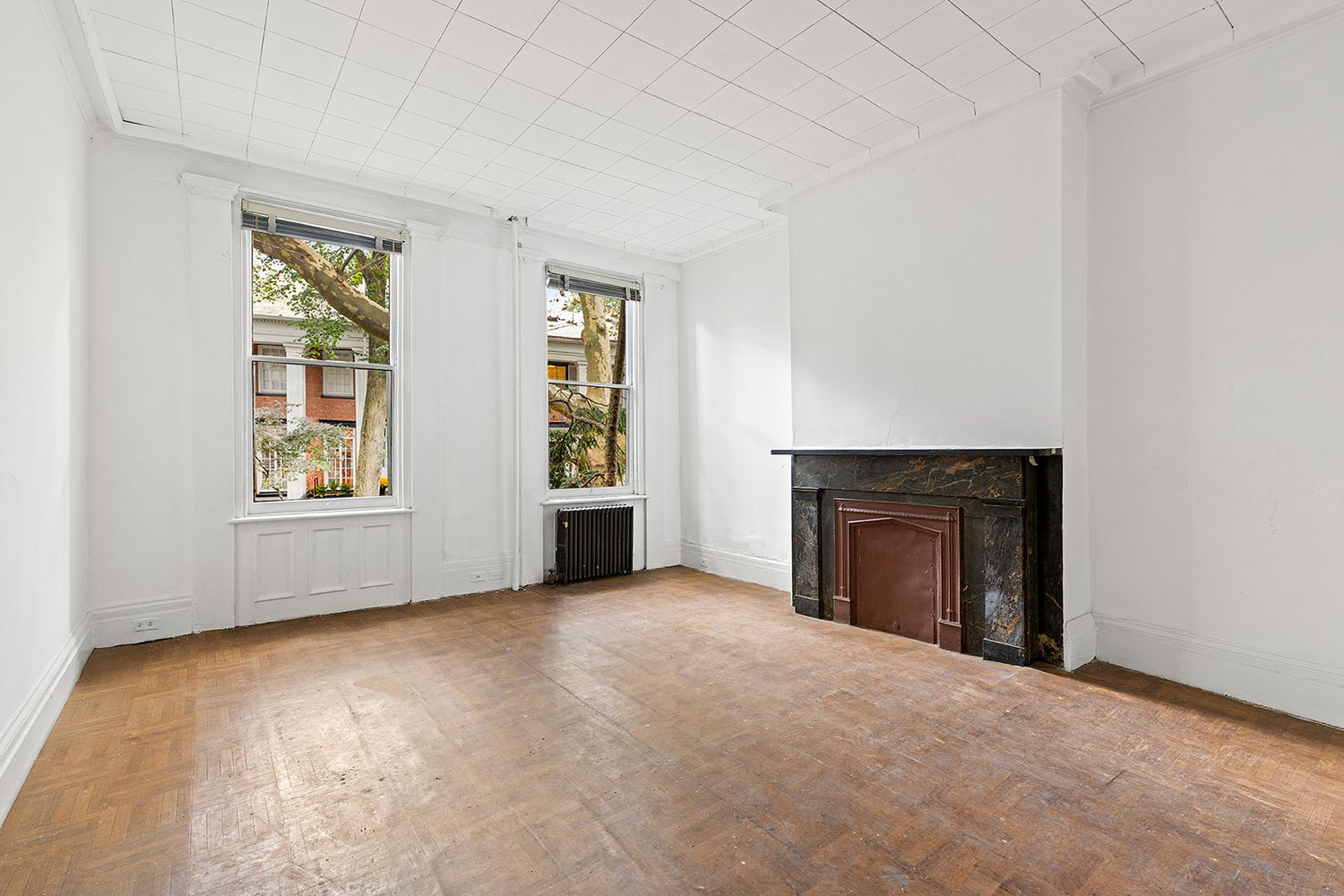 parlor with black marble mantel