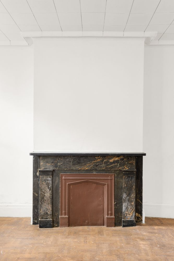 black marble mantel with pilasters