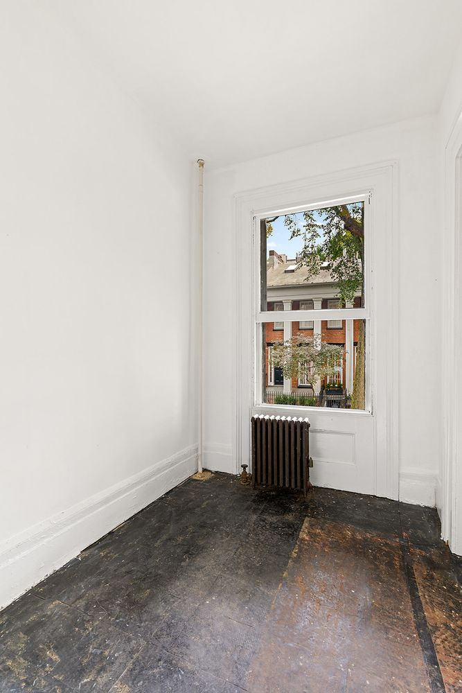 bedroom with window and white walls