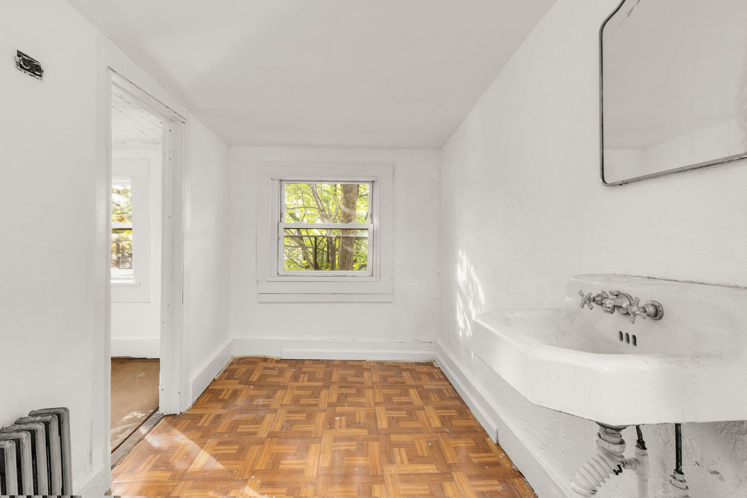 small bedroom with a deco era sink