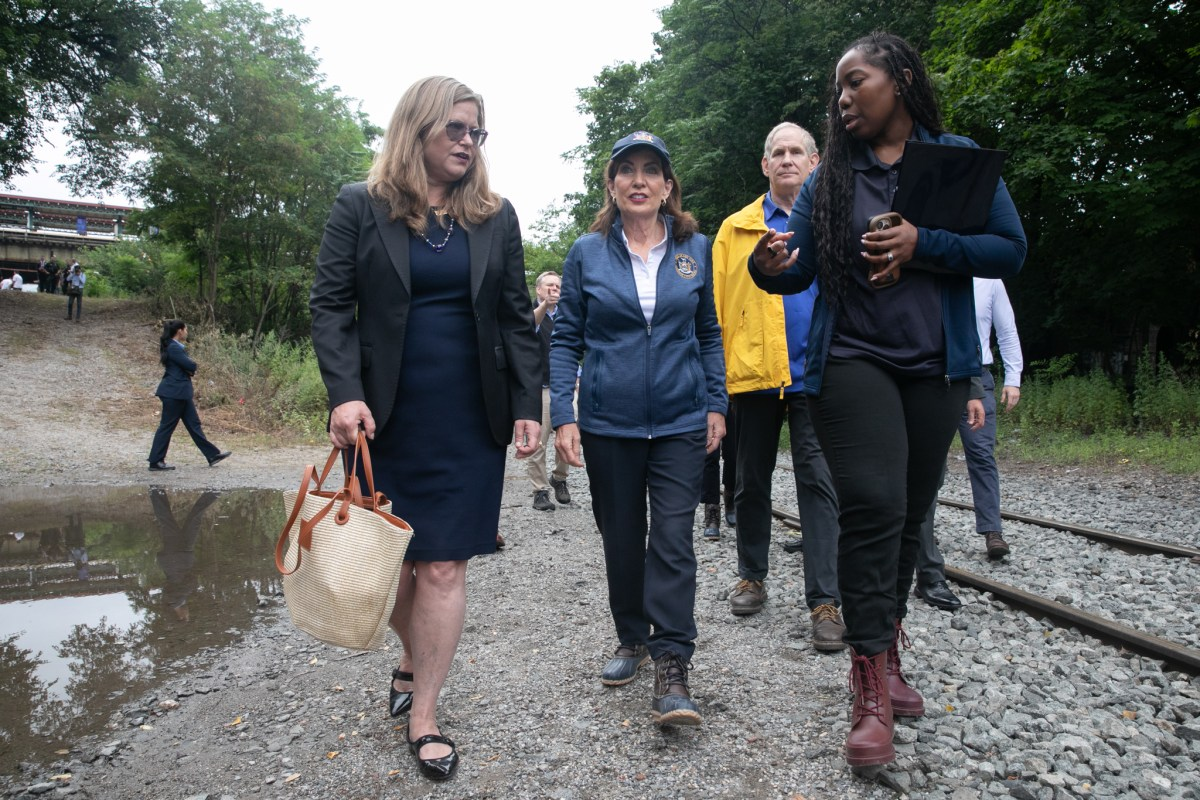 people walking on a rocky path