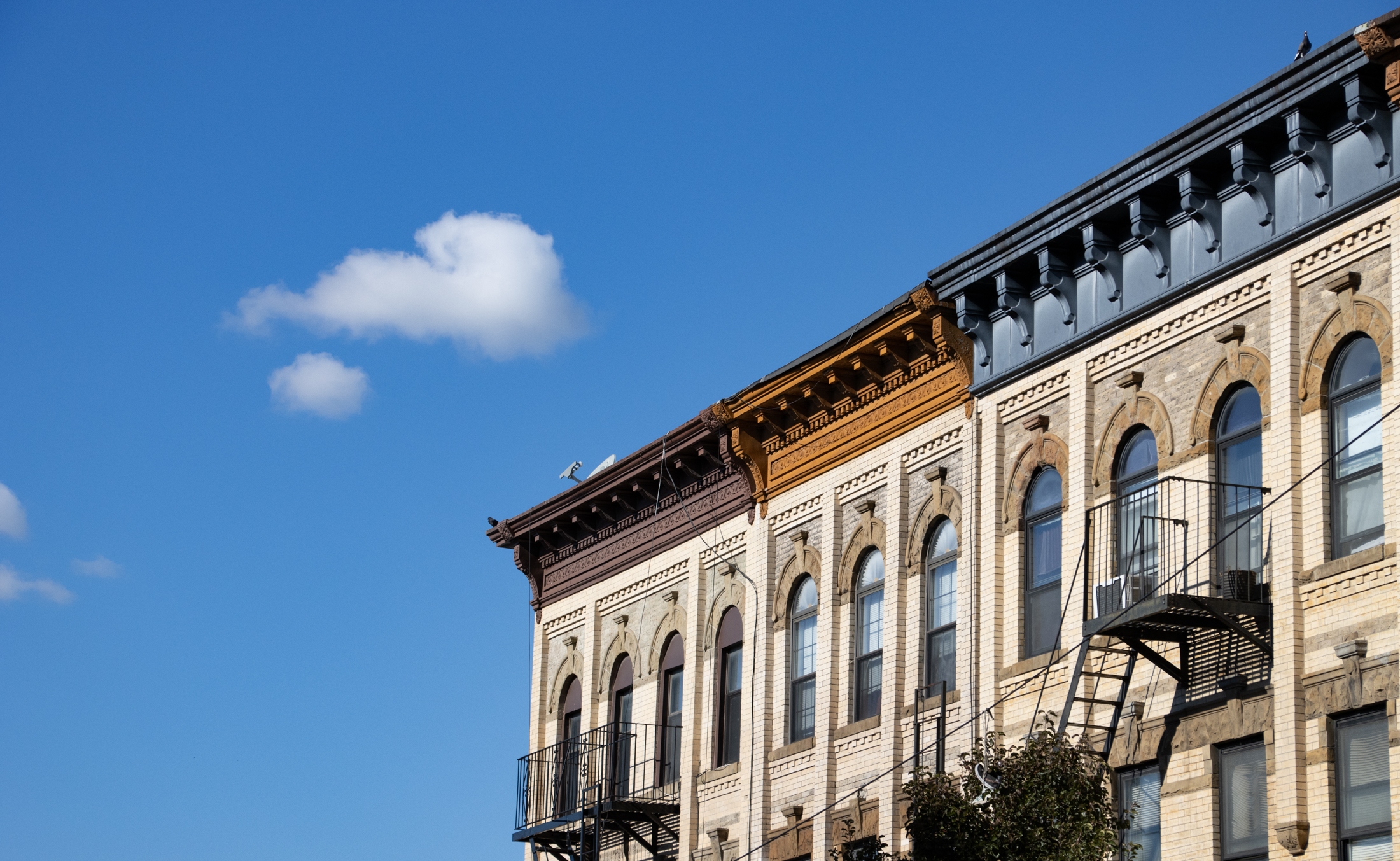 colorful cornices on brick buildings