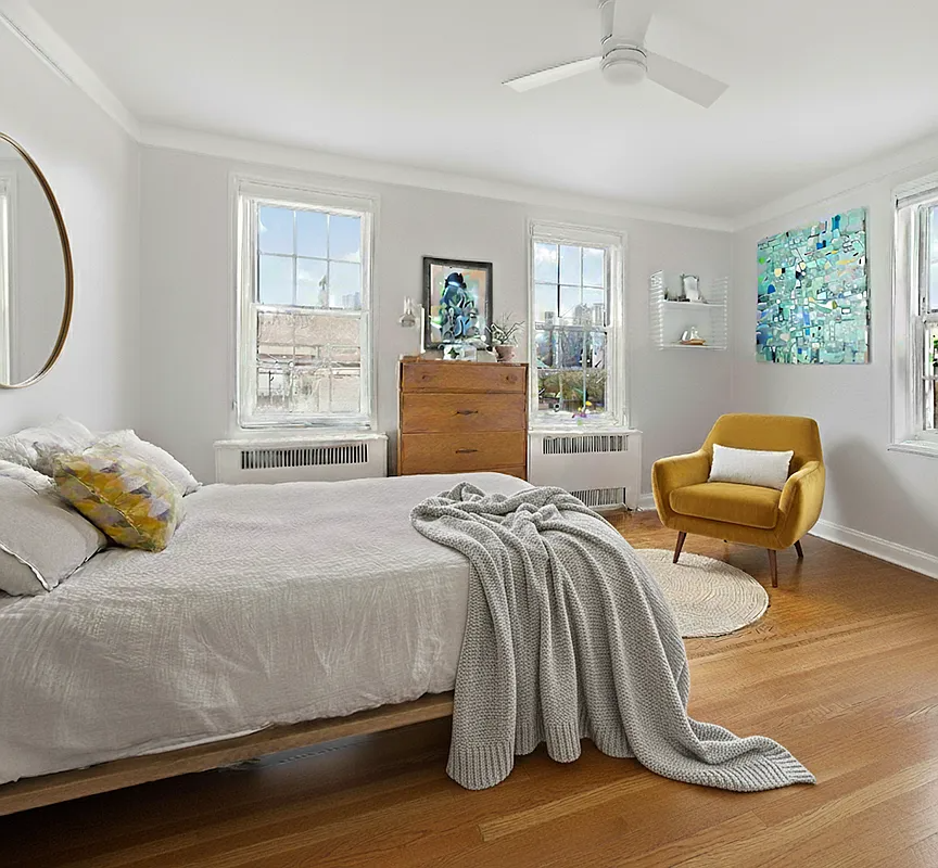 bedroom with wood floor, ceiling fan, two exposures