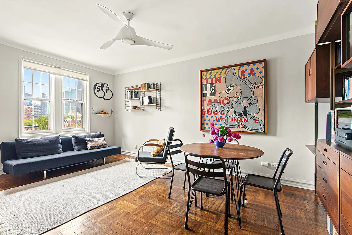 clinton hill living room with wood floor, white walls, ceiling fan