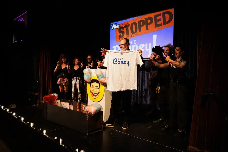 Coney Island USA’s artistic director, Adam Rinn, dropped a “The Coney” T-shirt into the casket.