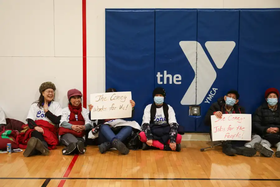 people holding signs