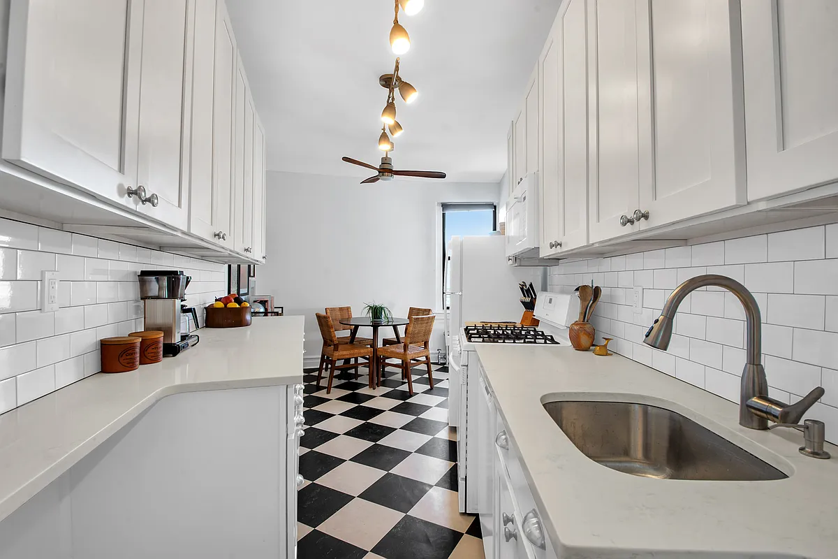 kitchen with white cabinets, checkerboard tile floor