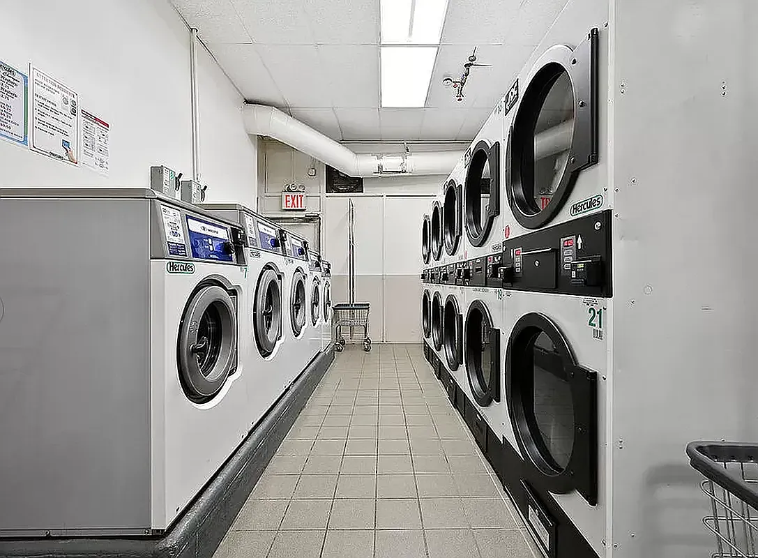 laundry room with multiple machines
