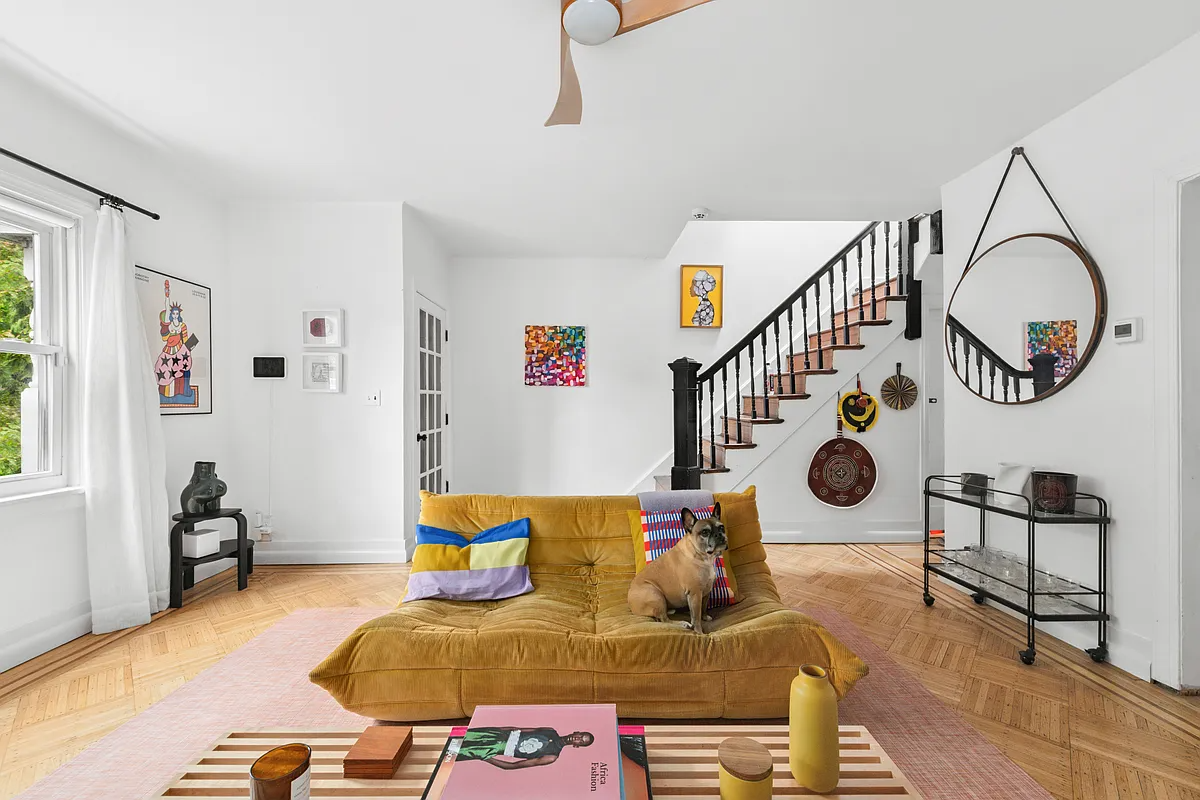 living room with wood floor, white walls