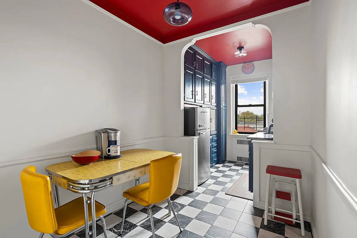kitchen with checkerboard floor, red ceiling and a dining nook
