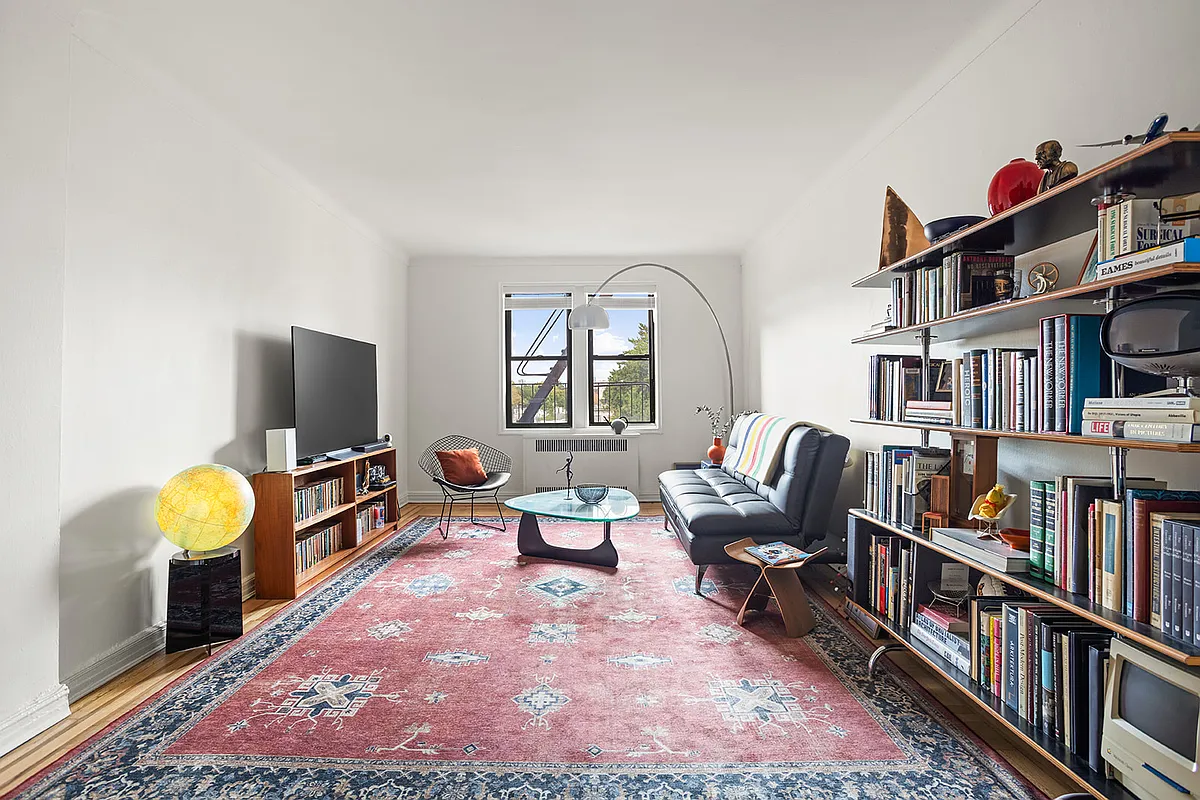 living room with wood floor, white walls