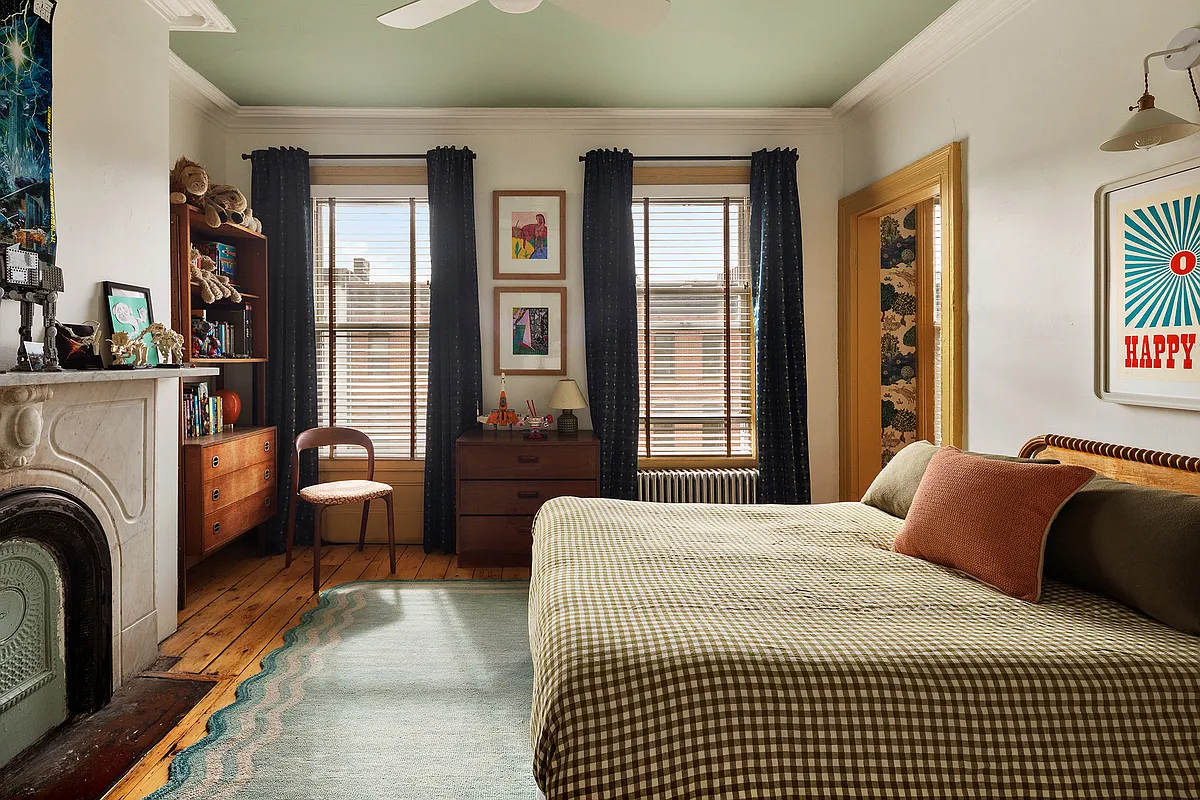 bedroom with green ceiling, marble mantel