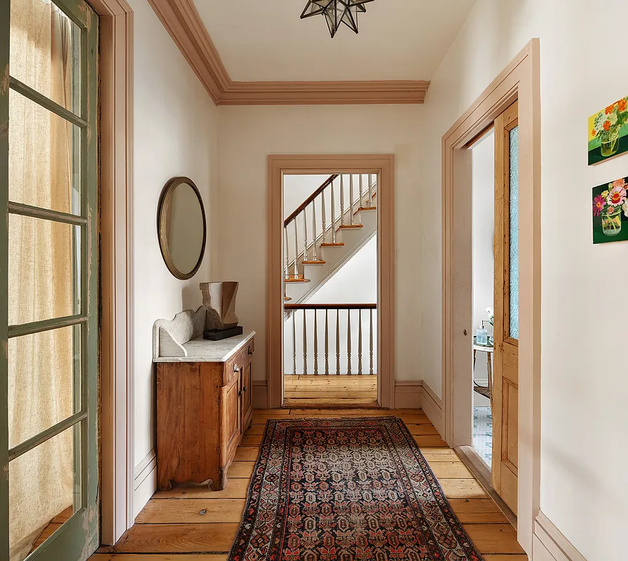 upstairs hall with pocket door to bathroom
