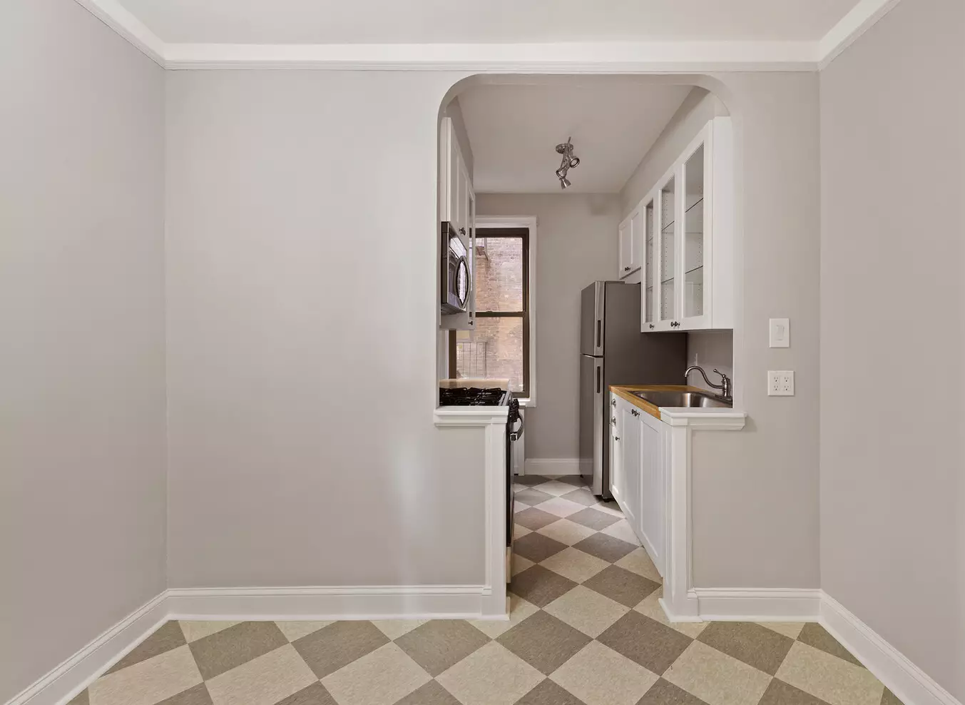 checkerboard floor in dining nook and kitchen